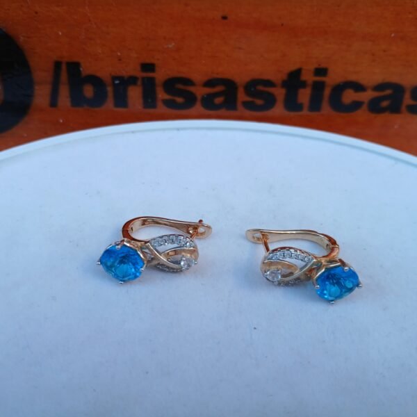 Aretes dorados con perla celeste acero inoxidable